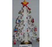 White christmas tree with small ornaments and yellow star